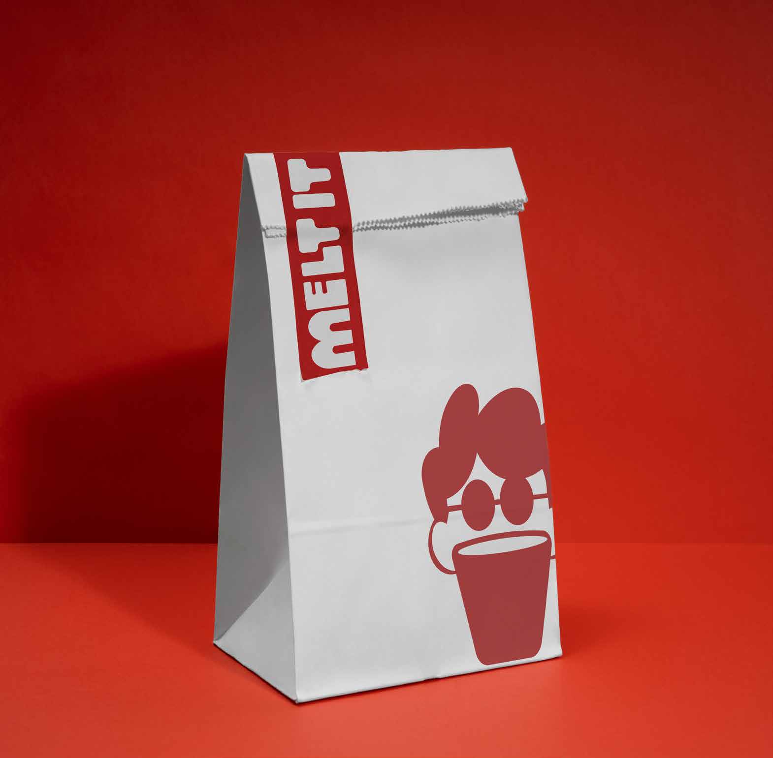 MELT IT red-branded bag on red background